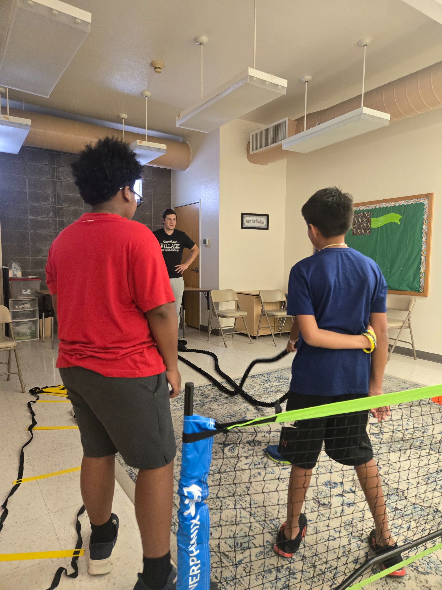 Heart Filled Academy students participating in physical education with an instructor and movement equipment